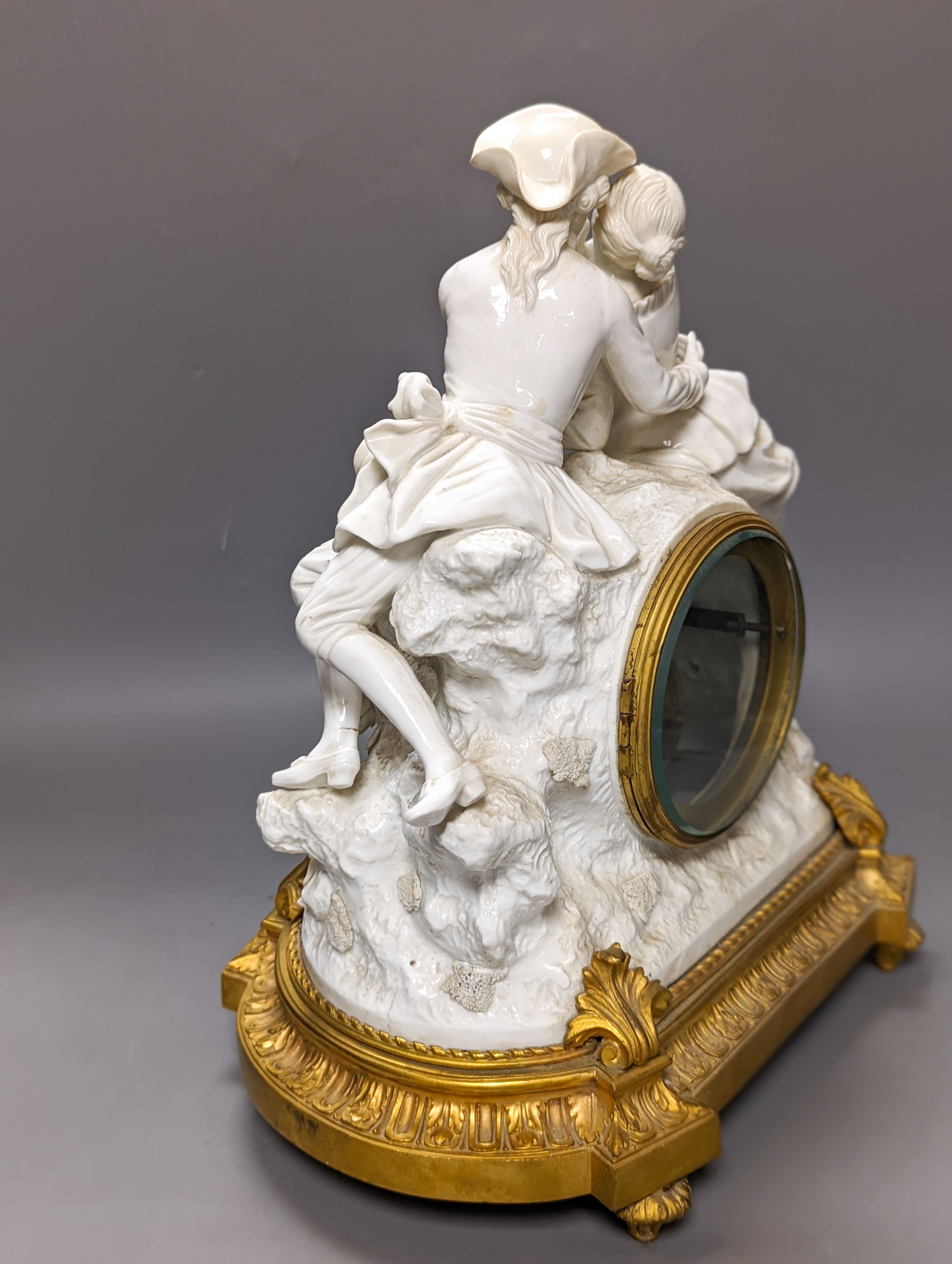 A late 19th century ormolu mounted Naples white porcelain mantel clock, width 30cm height 32.5cm